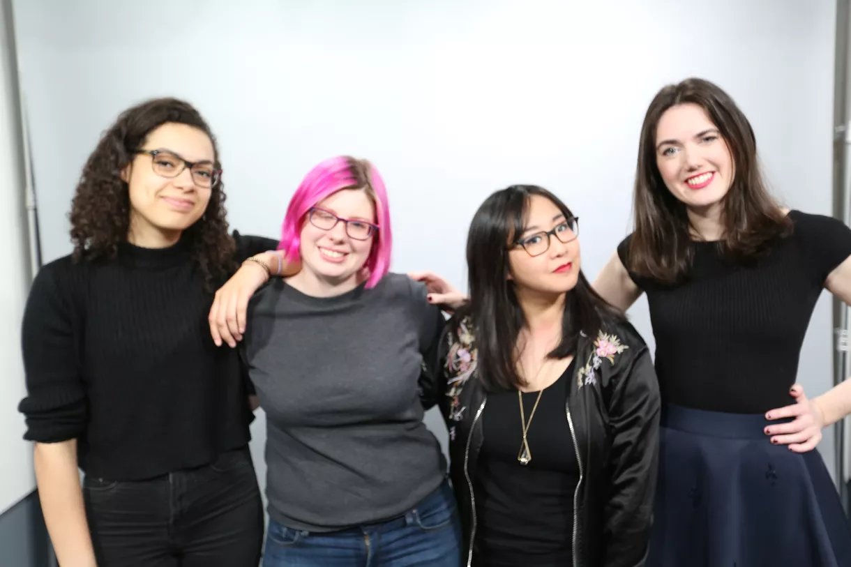 The hosts of the show posing for the camera.