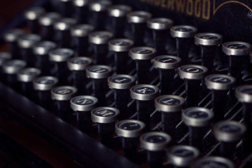 A close-up image of the keys on a vintage mechancial typewriter.