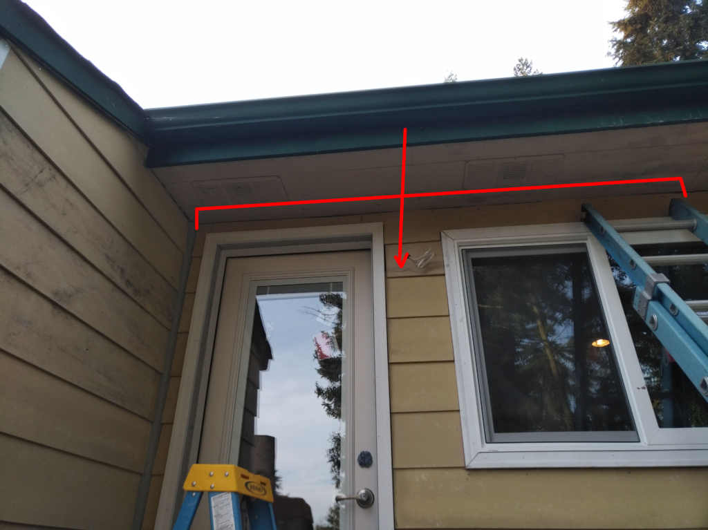 Image of the side of the house with a door and window visible. Several boards are indicated with lines and arrows.