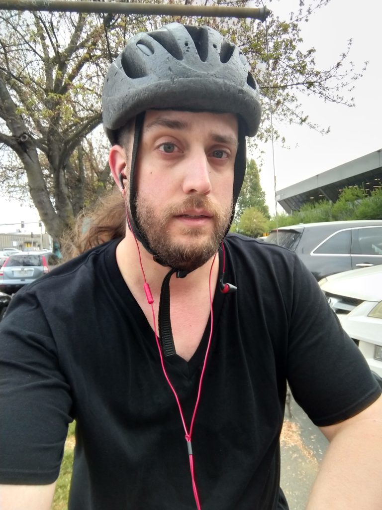 Me, looking kinda tired but otherwise good, wearing a battered bike helmet.